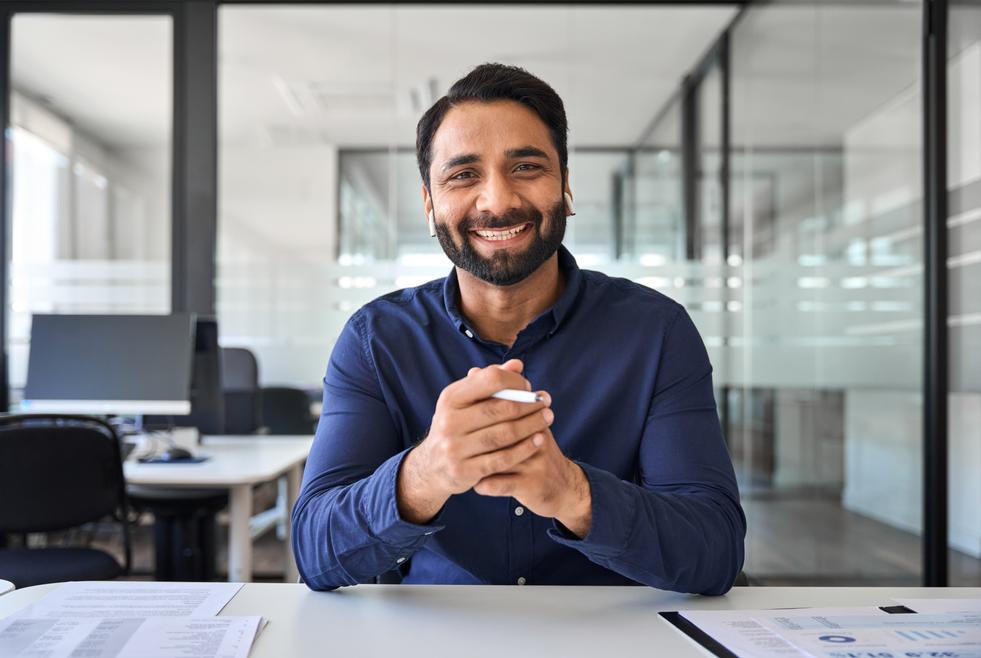 Professional searching for jobs in Dubai with skyline view